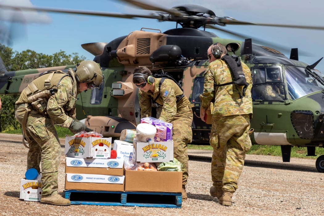Australian Army soldiers loading crates of fresh food, ready for delivery to areas of northern New South Wales affected by floods on 4 March 2022.