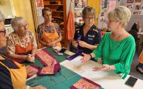 Days for Girls volunteers talk to former Rotary International president Jennifer Jones.