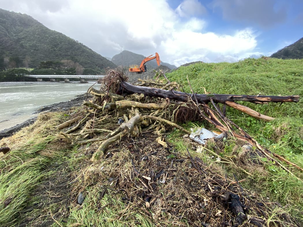 A surging tide ate into land beside the Awatere River mouth, exposing layers of rubbish and dragging them out to sea earlier this week
