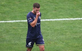 Phoenix's Tim Payne walks from the field after a red card