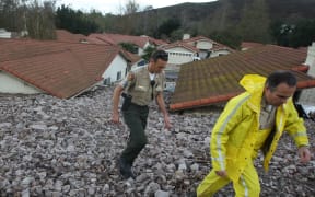 Houses are damaged after heavy rain triggered a mudslide in Ventura County, California on 12 December 2014 (local time).