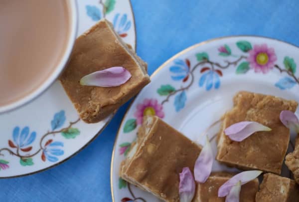 A plate of square slices of brown toffee.