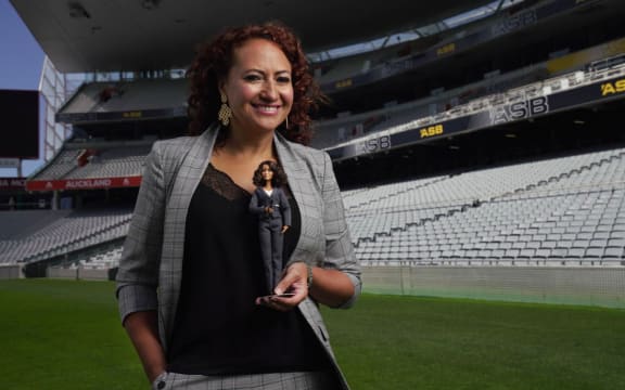 Melodie Robinson with the Barbie doll based on her.