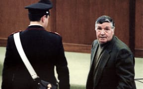 A 1993 picture shows mafia boss Salvatore "Toto" Riina during his trial at the high security prison Ucciardone in Palermo.
