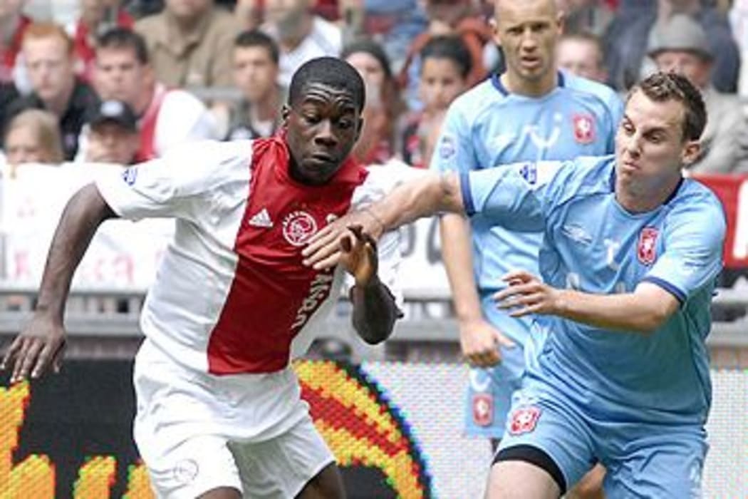 Jeffrey Sarpong (left) playing for Ajax Amsterdam in the Dutch League