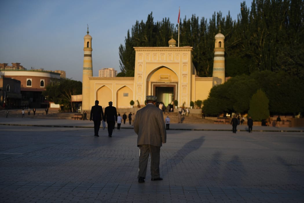 A Uyghur man walks towards the Id Kah mosque for Eid al-Fitr prayers in Kashgar, in China's western Xinjiang region, June 2019.