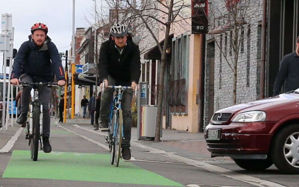 Cyclists on the St Asaph Street cycleway in central Christchurch have to watch out for cars pulling across it.