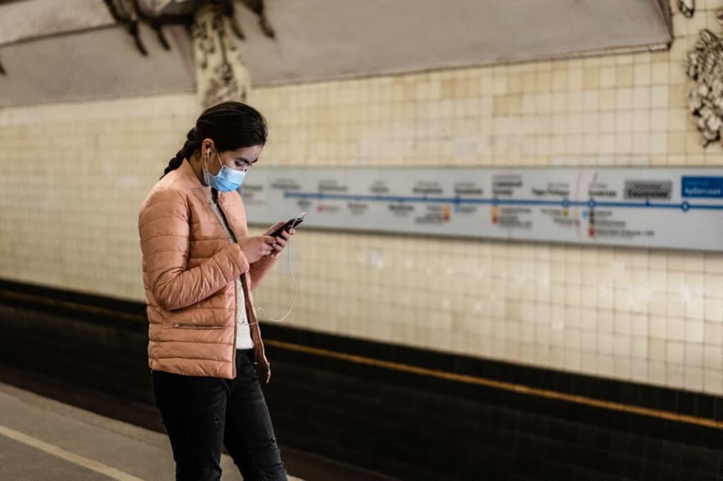 A girl wearing medical mask in the metro of Moscow. Moscow, march 2020.