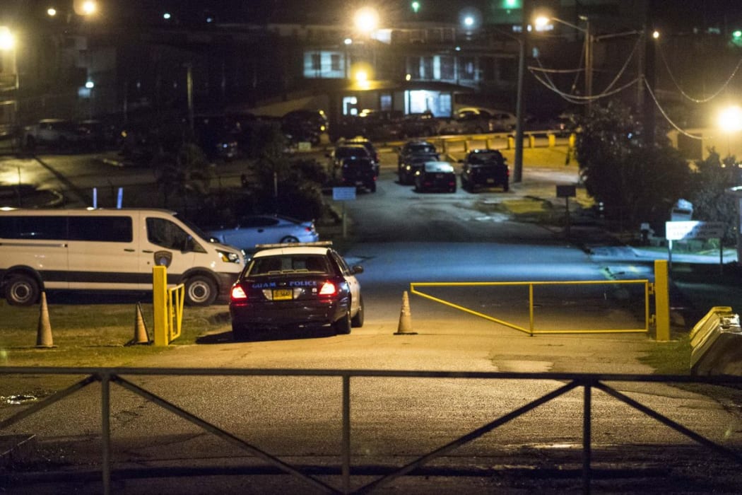 A police vehicle enters the Guam Department of Corrections compound during an early morning Drug raid that saw several prison officials arrested. Thursday August 24.