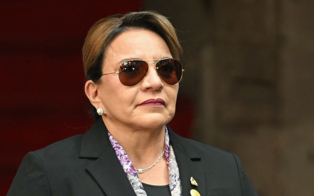 Honduras' President Xiomara Castro attends an official welcoming ceremony with Mexico's President Claudia Sheinbaum (out of frame) at the National Palace in Mexico City on November 25, 2025. Castro is in Mexico on official visit. (Photo by Yuri CORTEZ / AFP)