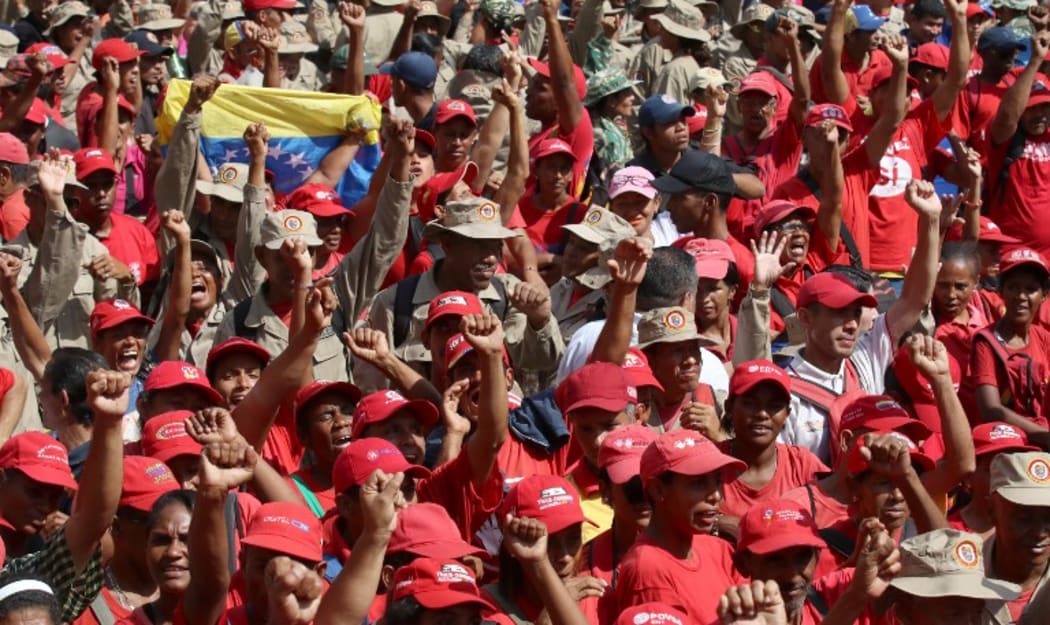 CARACAS, VENEZUELA - MARCH 10 : People gather in front of the Miraflores Palace during a meeting n support of Venezuelan President Nicolas Maduro, in Caracas, Venezuela on March 10, 2019.