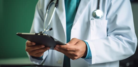 Generative AI : Doctor holding stethoscope and touching on screen of digital tablet computer close up EHRs Electronic Health Record system EMRs Electronic Medical Record system e h