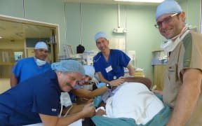 Canvasback l-r hospital nurse Joash Jilak, Canvasback nurses Jack Roberts and Deborah Yoder, anesthesiologist Dr. Brad Tym, and ENT plastic surgeon Dr. Tal Dagan