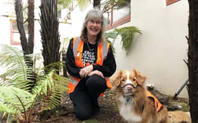 Debbie Bishop with New Zealand's first frog detection dog Holly.