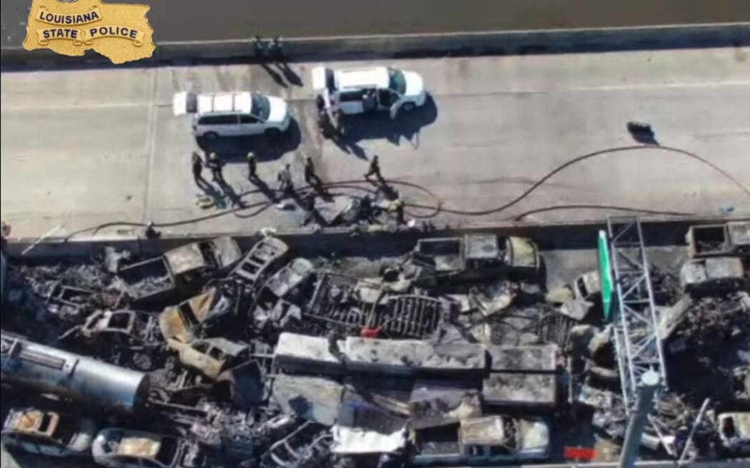 This still image obtained from a handout video released by the Lousiana State Police on Facebook shows burned vehicles after a fire erupted following a crash on Interstate 55 highway in St. John the Baptist Parish, Louisiana, on October 23, 2023. A large cloud of fog enveloping a highway led to at least 158 car crashes and seven deaths in the southern US state of Louisiana, authorities said. The so-called "super fog," which US media reported was caused by a mixture of marsh fires and dense fog, led to a massive pileup on Interstate 55, about 30 miles (48 kilometers) outside of New Orleans, the Louisiana State Police said in a statement. (Photo by Louisiana State Police / AFP) / RESTRICTED TO EDITORIAL USE - MANDATORY CREDIT "AFP PHOTO / LOUISIANA STATE POLICE " - NO MARKETING - NO ADVERTISING CAMPAIGNS - DISTRIBUTED AS A SERVICE TO CLIENTS