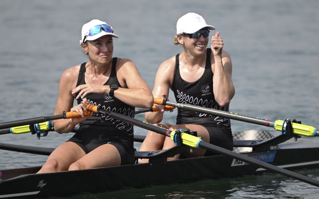 New Zealand's Brooke Francis (R) and New Zealand's Lucy Spoors celebrate winning in the women's double sculls final rowing competition at Vaires-sur-Marne Nautical Centre in Vaires-sur-Marne during the Paris 2024 Olympic Games on August 1, 2024. (Photo by Olivier MORIN / AFP)