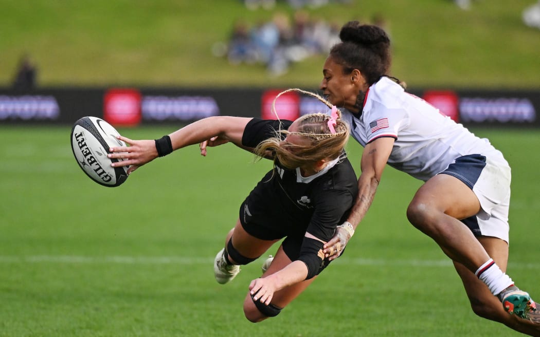 Jorja Miller offloads for a Black Ferns try.
