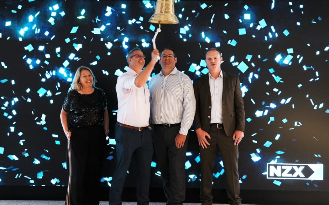 Members of company Pacific Edge ring the NZX bell.