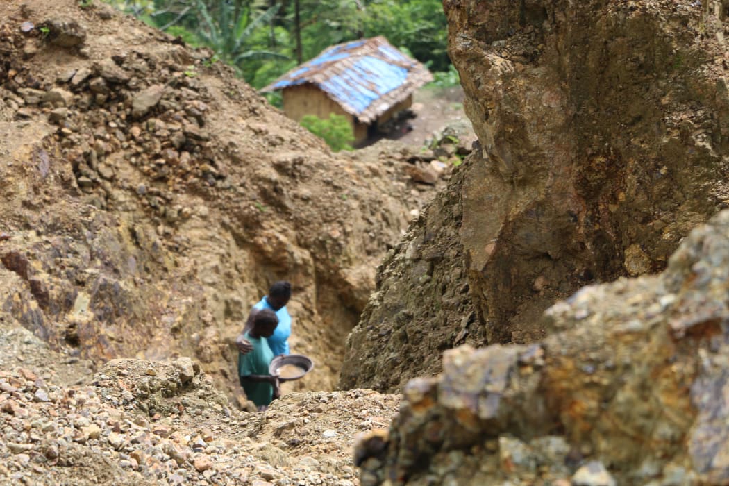 Gold panning on the fringe of Bougainville's Panguna mine, decades after it was closed for large scale mining.