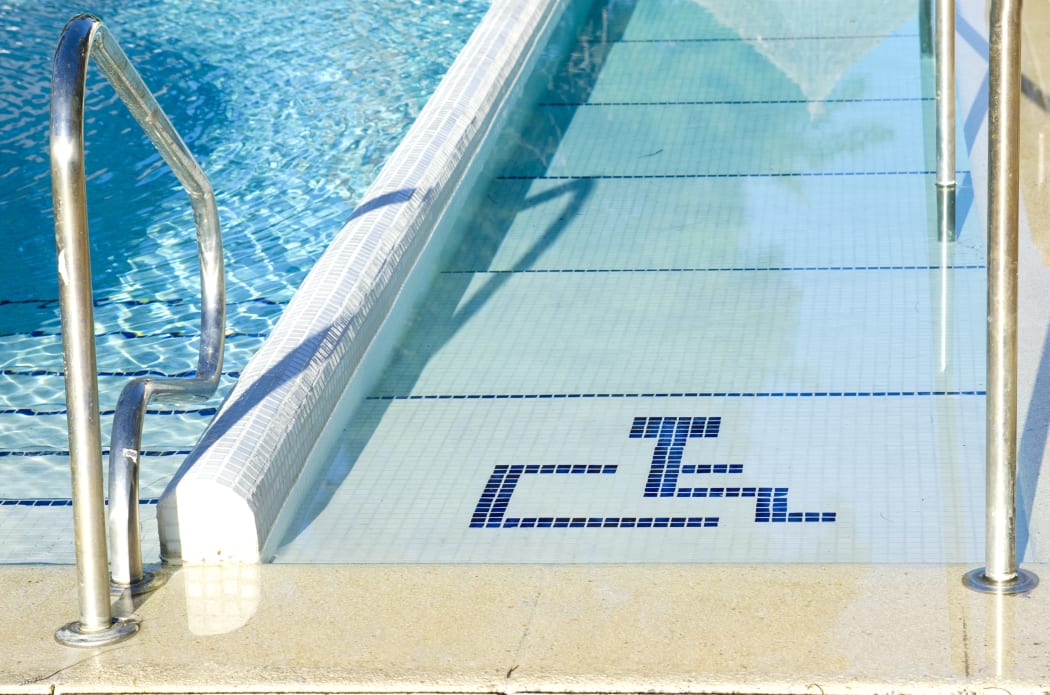 Access to swimming pool for wheelchairs.