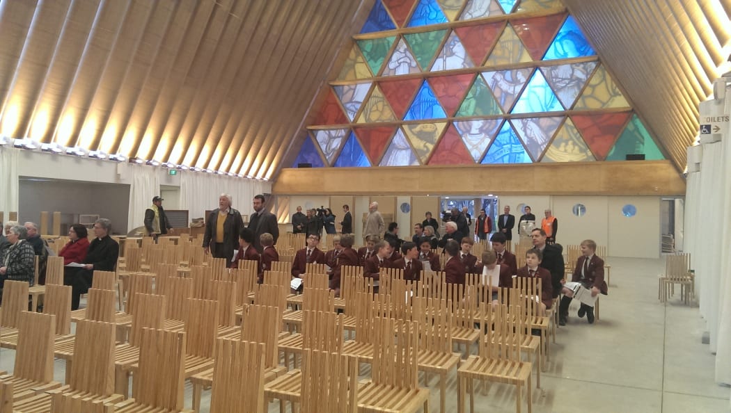 The Trinity Window above the entrance to the cardboard cathedral.