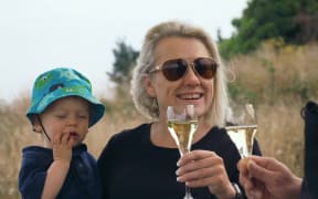 Kaikōura winemaker Mel Skinner holds a glass of sparkling wine from her winery, Esses.