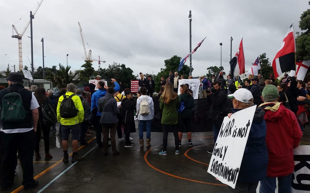 More than 50 people at a  protest against a defence industry forum.