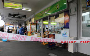 Police cordon off the scene at Grey Lynn supprette, Hylite Dairy after a mother and son were stabbed.
