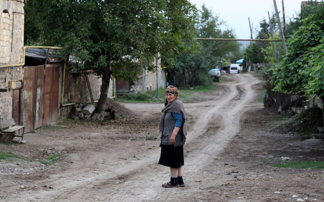 An elderly woman pauses in the Armenian village of Kornidzor on September 22.