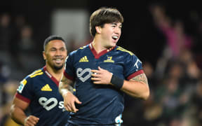 Connor Garden-Bachop celebrates a try for the Highlanders against Reds in 2023.