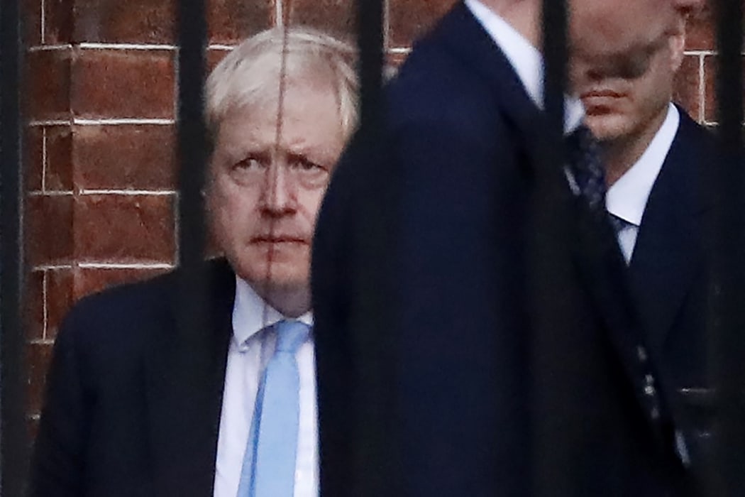 Britain's Prime Minister Boris Johnson leaves from the rear of 10 Downing Street as last-ditch efforts on Brexit continue.