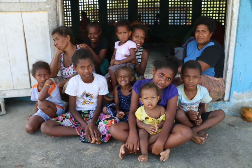 Wendy Karo( far right back row) says mothers in the evacuation centres worry for their children's education.