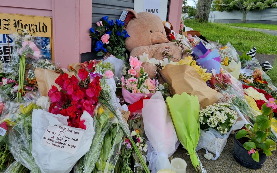 A sign reading 'Justice for Janak' among flowers and notes outside the Rose Cottage Supererette in Sandringham, 28 November, 2022.