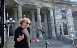 Disability advocate Jane Carrigan speaking outside Parliament on 2 July, 2026.