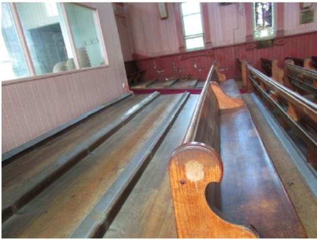 The missing pews from the back of the church.