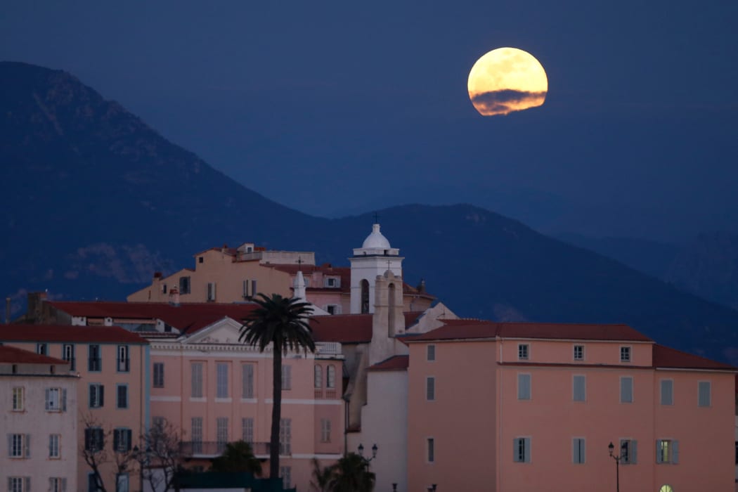 A 'Super Snow Moon' rise over Ajaccio on the French Mediterranean island of Corsica, on February 19, 2019.