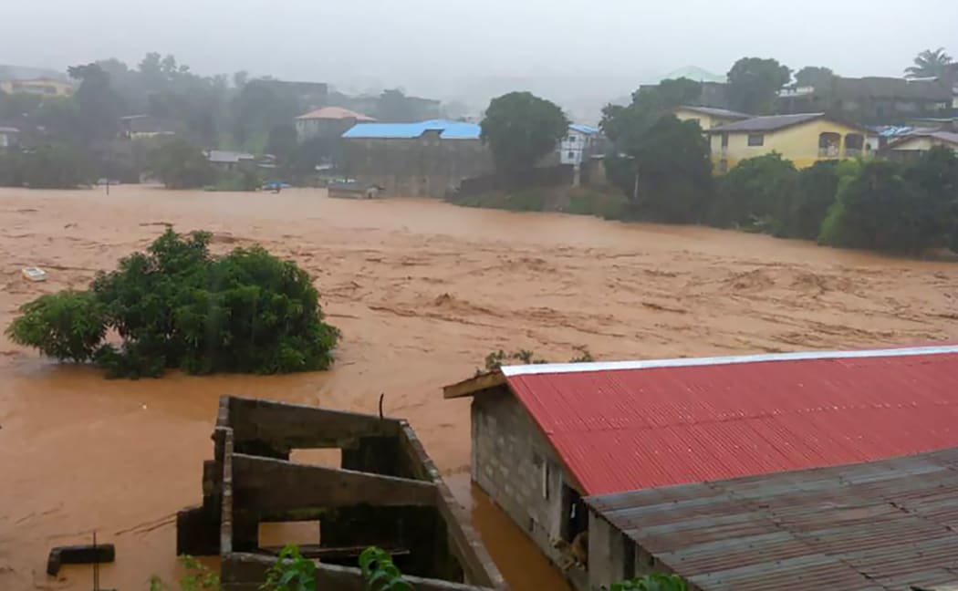 This handout picture released on August 14, 2017, by Society 4 Climate Chnage Communication Sierra Leone, shows flooded streets in Regent near Freetown.
