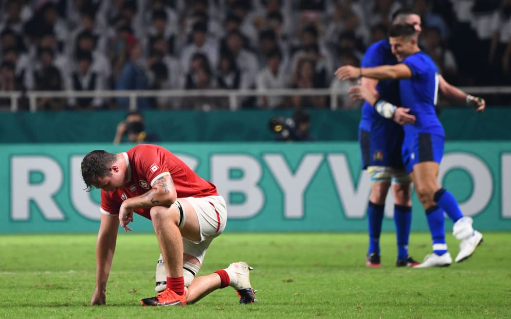 Canada's lock Conor Keys (L) reacts after losing  during the Japan 2019 Rugby World Cup Pool B match between Italy and Canada.