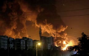 A fire blazes in the oil depots of Shahran, northwest of Tehran, on June 15, 2025. Israel and Iran exchanged fire on June 14, a day after Israel unleashed an unprecedented aerial bombing campaign that Iran said hit its nuclear facilities, "martyred" top commanders and killed dozens of civilians. (Photo by ATTA KENARE / AFP)