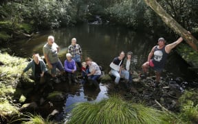 Val Faulkner (fourth from left) at Patuwairua Stream with (from left) Anne-Marie Franks, Mike Franks, Lynda Franks, Theo Taylor, Wendy Taylor, Izzy Whitehead, Ryan Whitehead and Sam Whitehead.