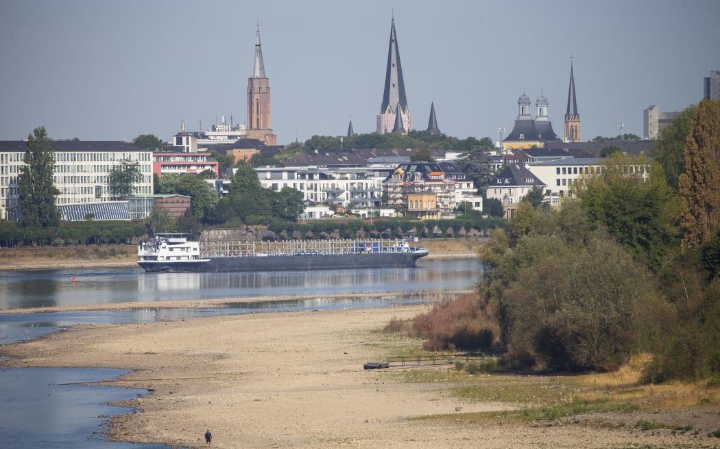 A cargo ship on the Rhine near Bonn, 21 August 2022. Due to the ongoing drought, the Rhine level has reached a low.