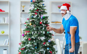 Injured man celebrating christmas at home