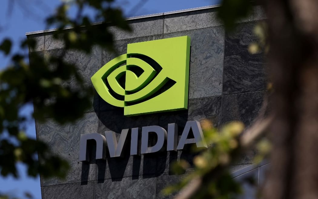 (FILES) The Nvidia headquarters on May 21, 2024 in Santa Clara, California. Nvidia edged ahead of other tech companies on June 18, 2024, to become the world's most valuable publicly traded company in the latest sign of the might of artificial intelligence. The chip company, which has enjoyed a monumental ascent over the last 18 months amid enthusiasm over generative AI, jumped 3.4 percent near 1725 GMT, giving it a market capitalization of about $3.3 trillion, slightly ahead of Microsoft and Apple. (Photo by JUSTIN SULLIVAN / GETTY IMAGES NORTH AMERICA / AFP)