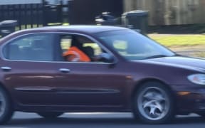 The man escaped the scene in a maroon Nissan Maxima.