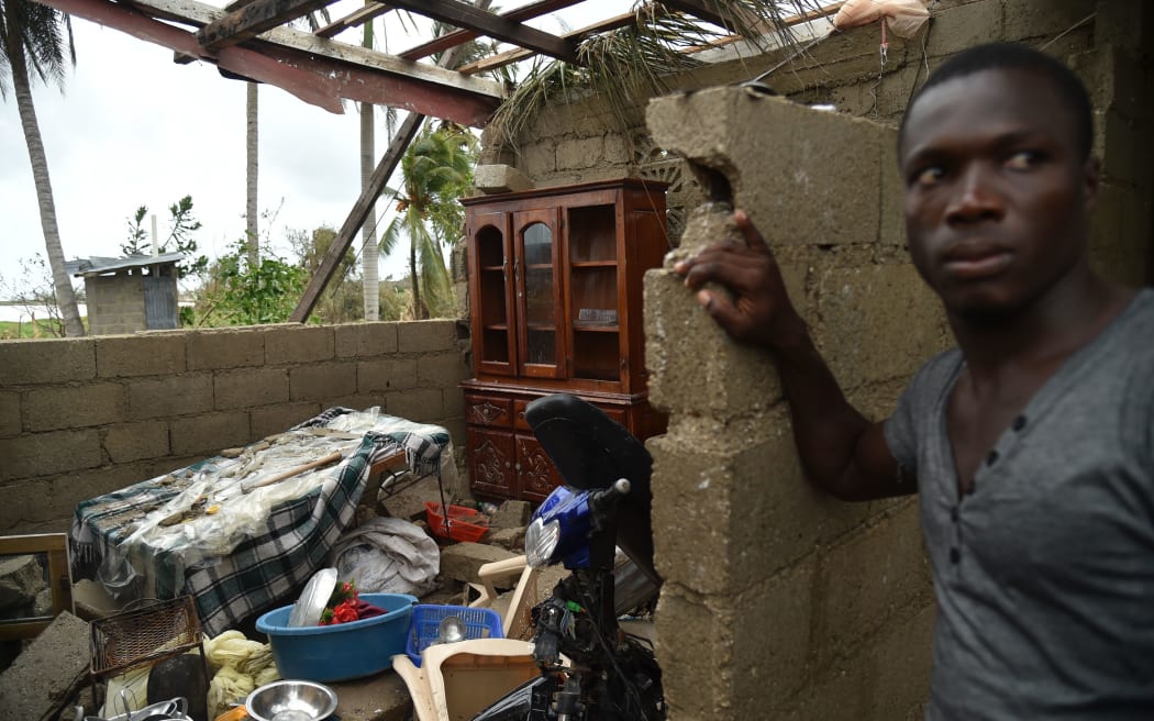 Stanley stands in his destroyed house after the passing of Hurricane Matthew, in Les Cayes, in Southwest Haiti.