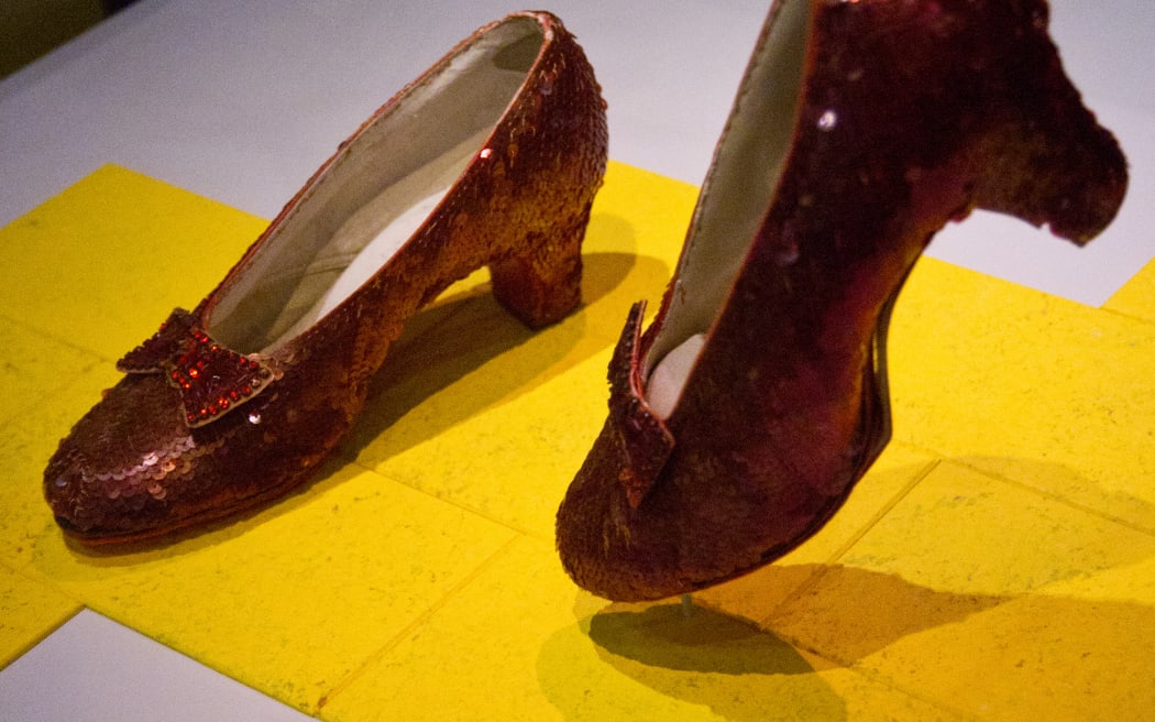 The famous ruby slippers worn by actress Judy Garland, in the character of Dorothy in the 'Wizard of Oz', on display 11 April, 2012 at the Smithsonian Mueseum of American History in Washington, DC, during the press preview for 'American Stories'. AFP PHOTO/Karen BLEIER (Photo by KAREN BLEIER / AFP)