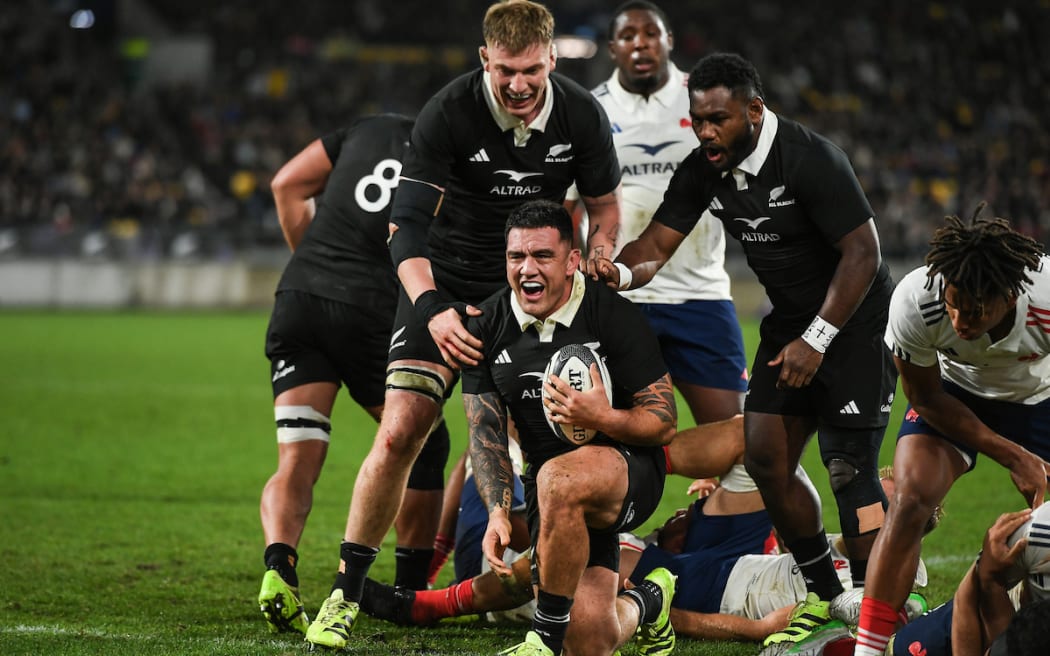 Codie Taylor scores against France.