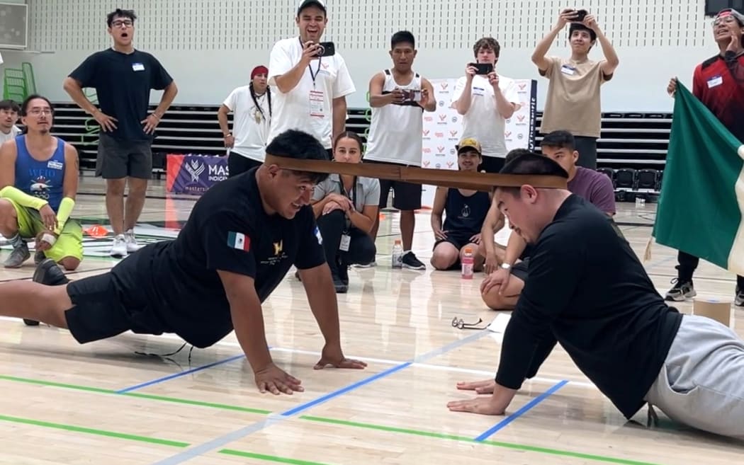 The object of the neck pull is to overpower the opponent using neck muscles and a leather strap around the back of the contestants’ heads.