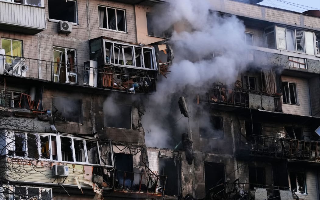 Smoke comes out from a damaged residential building following an air strike in Kyiv on 14 November, 2025, amid the Russian invasion of Ukraine.