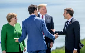 German Chancellor Angela Merkel, Canadian Prime Minister Justin Trudeau,  
US President Donald Trump and French President Emmanuel Macron at the G7 summit in Canada.
